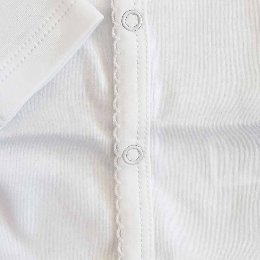 Body blanco para bebé: broches circulares en la costura frontal