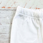 Pantalón blanco básico con pretina elástica y pierna lisa