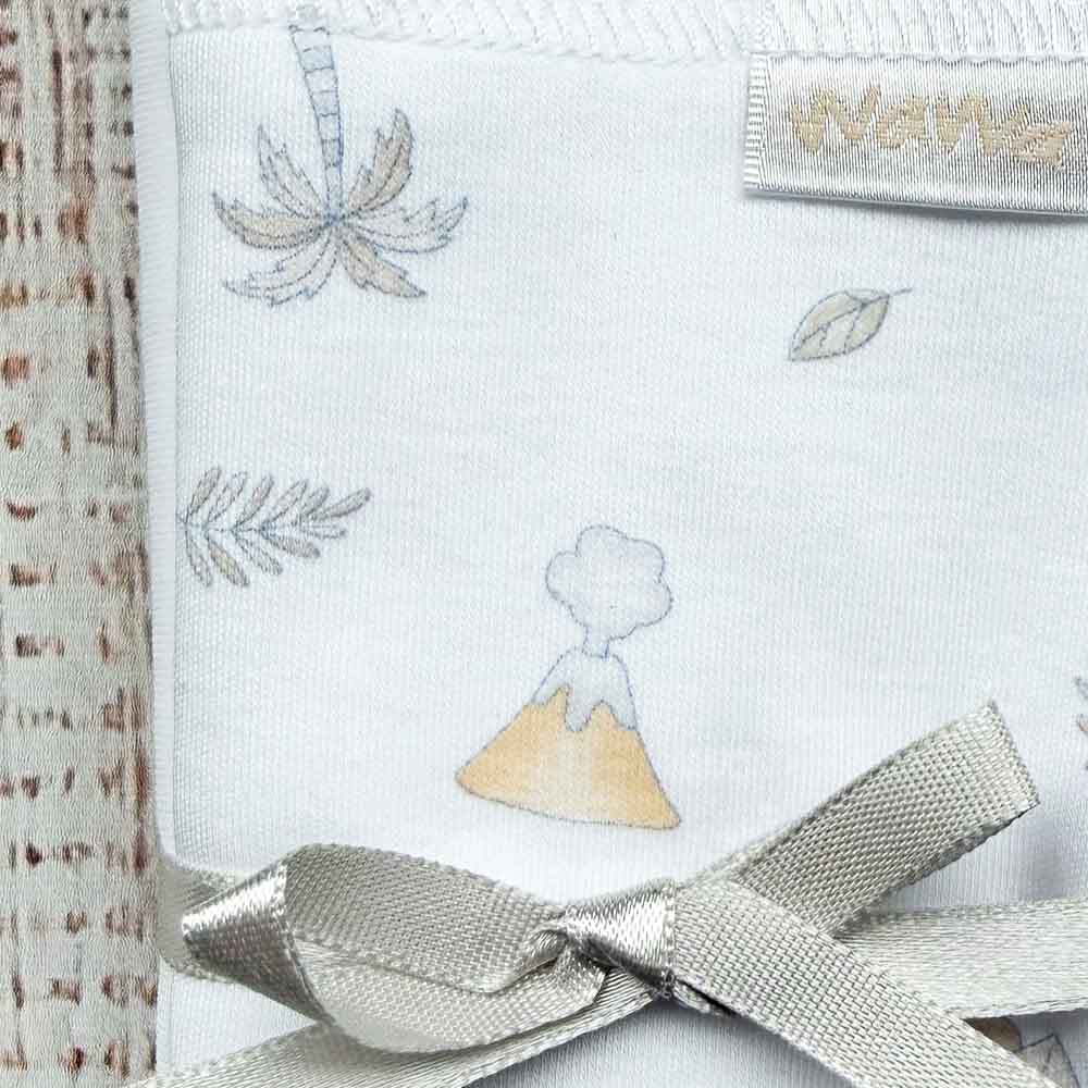 Tuto de tela blanca con estampado de dinosaurios y lazo gris cruzado