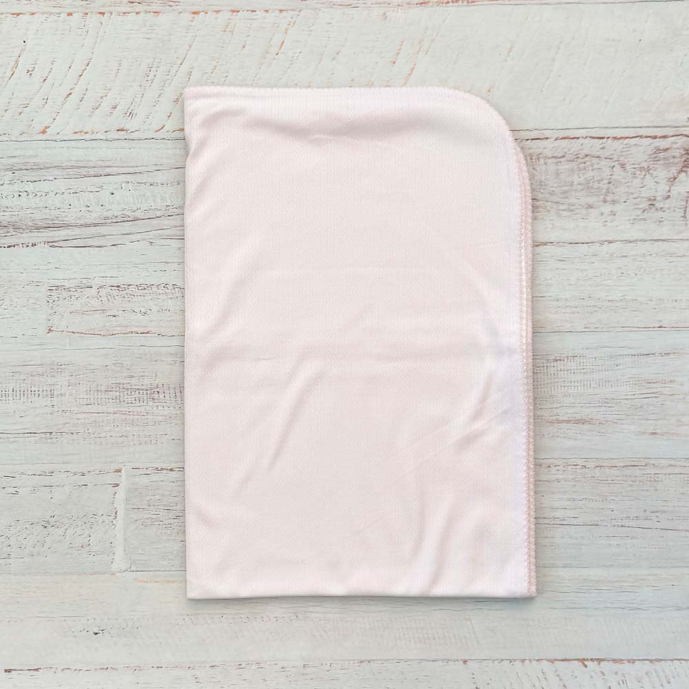 Manta jacquard rosada lisa con orilla redondeada