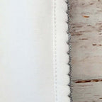 Borde lateral de manta smock gris con dobladillo y puntada ondulada