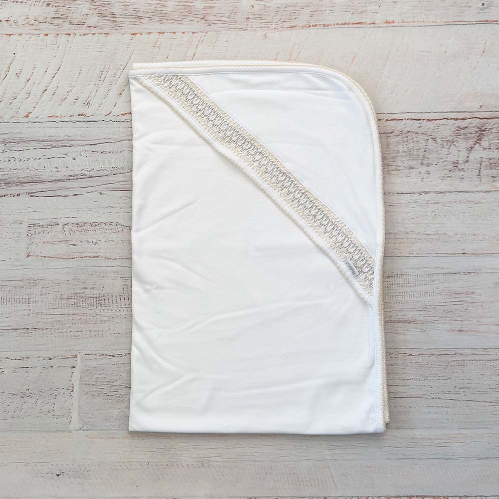 Manta smock beige rectangular con ribete cruzado y costuras decorativas