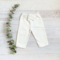 Pantalón de bebé blanco con cintura elástica y moño delantero, pierna recta