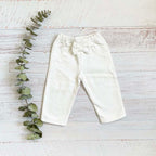 Pantalón de bebé blanco con cintura elástica y moño delantero, pierna recta